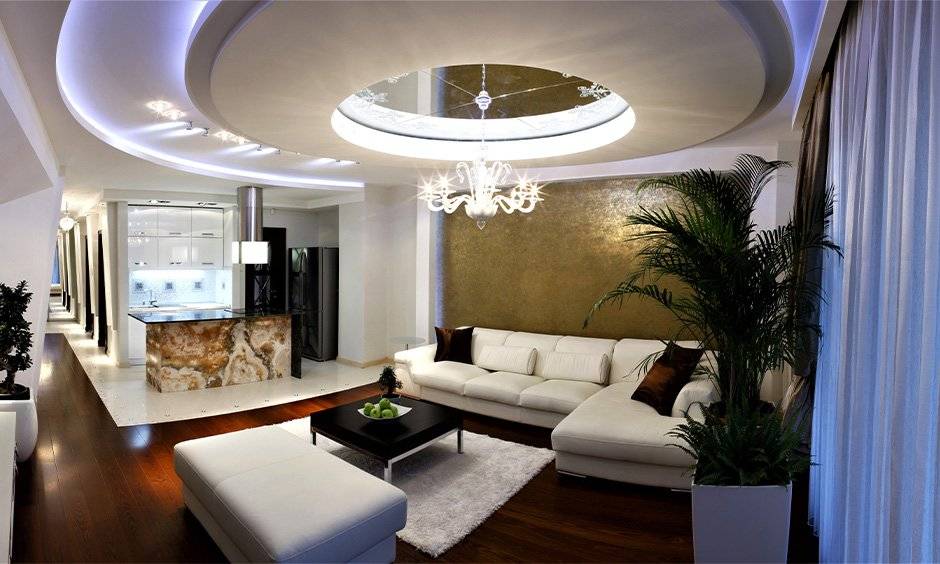 Circular POP ceiling design for drawing room with blue-toned lighting to lend some coolness