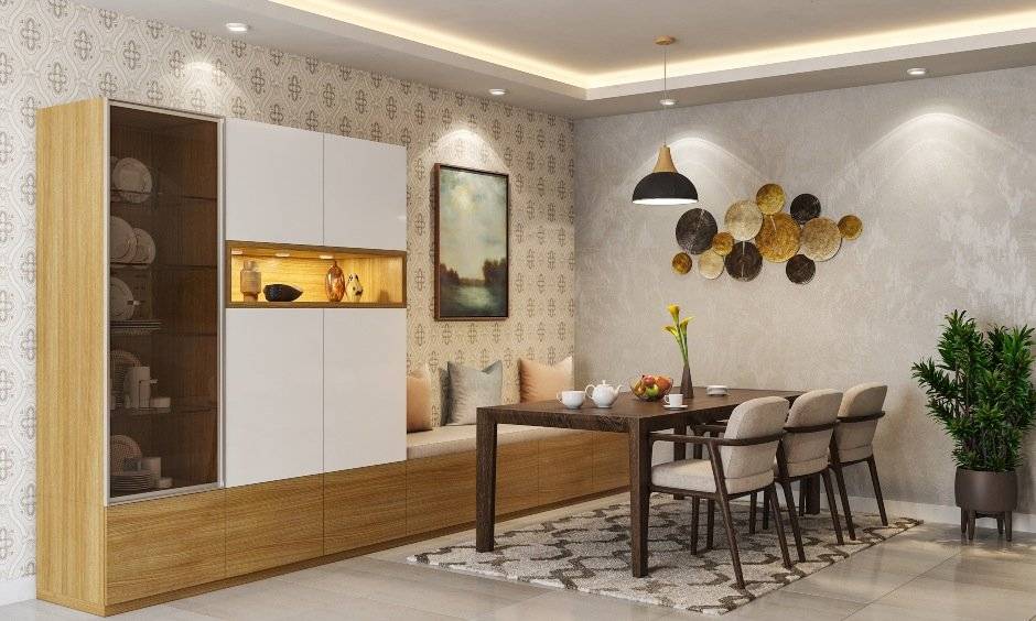 This dining room interior design is for people with small homes with walnut wood dining table and chairs and a glass front crockery unit