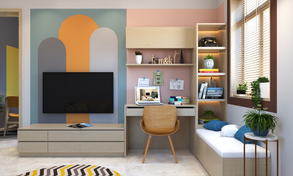 A bright living room with a colourful geometric wall adds playful personality.