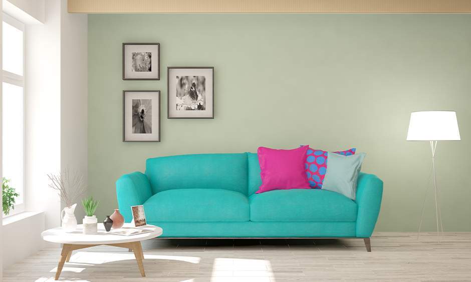 Drawing room wall colour combination, muted green shades complemented by earthy tones