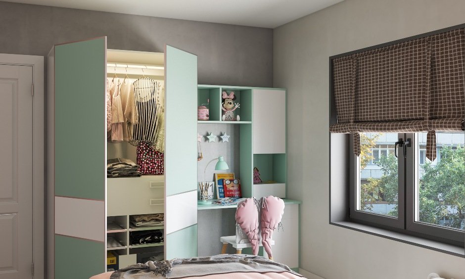 Girls kids bedroom design with study table and attached wardrobe for storage kids essentials