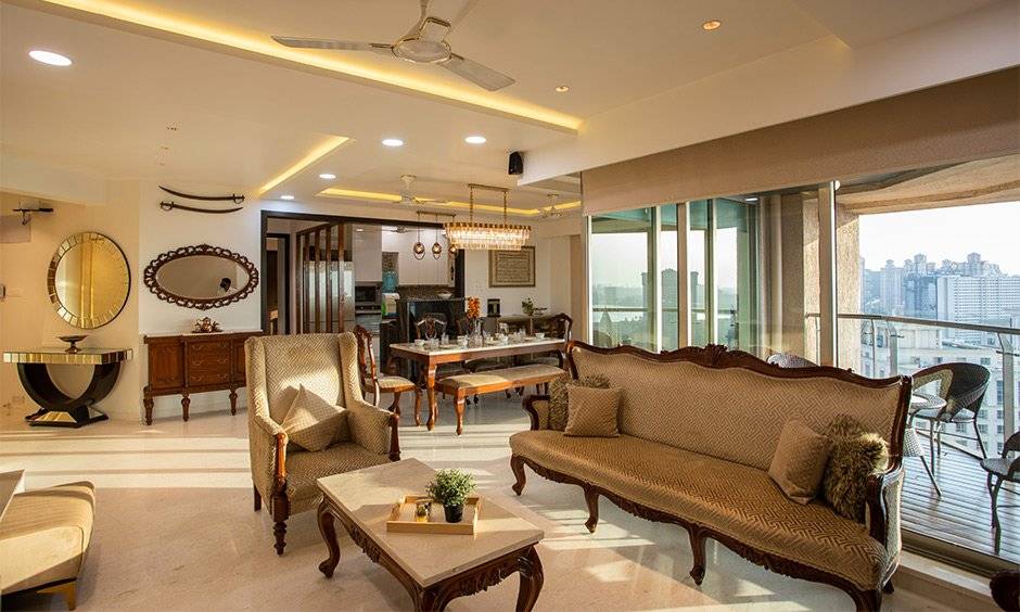 Interior design services in mumbai for a royal living room with antique furnishings