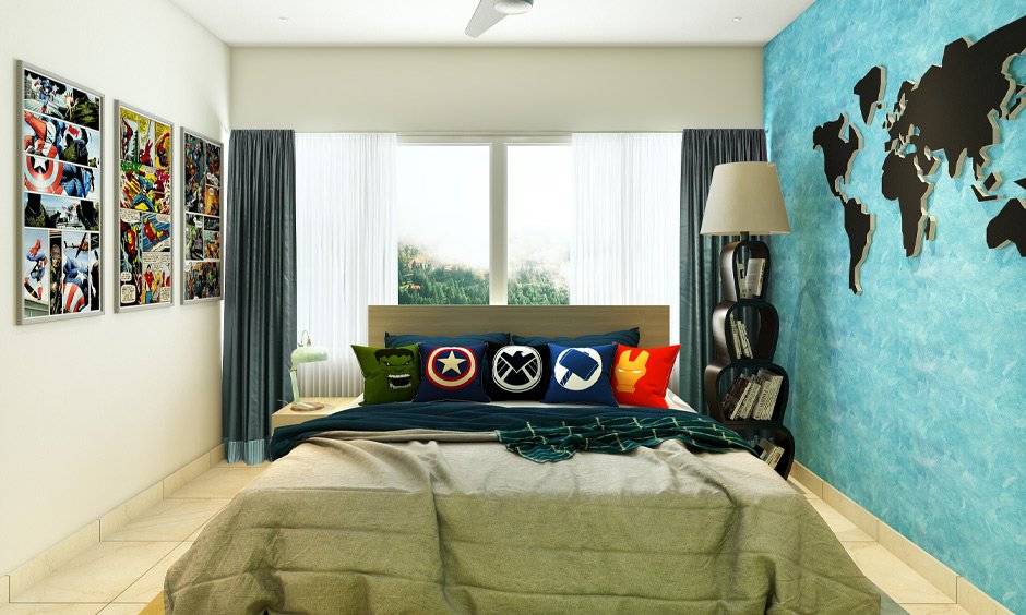 Kids’ room decor ideas for boys framed superhero comics on one wall, and a world map sticker on the other is a slick addition