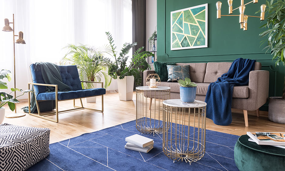 Living room interior design with green accent wall and its cost