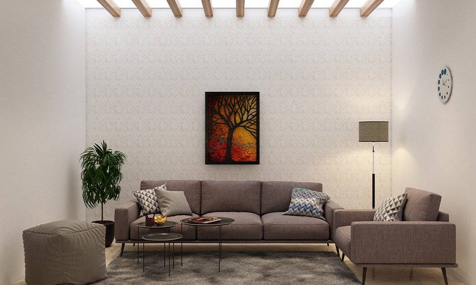 Old Bombay inspired living room type with false ceiling and wooden panelling.