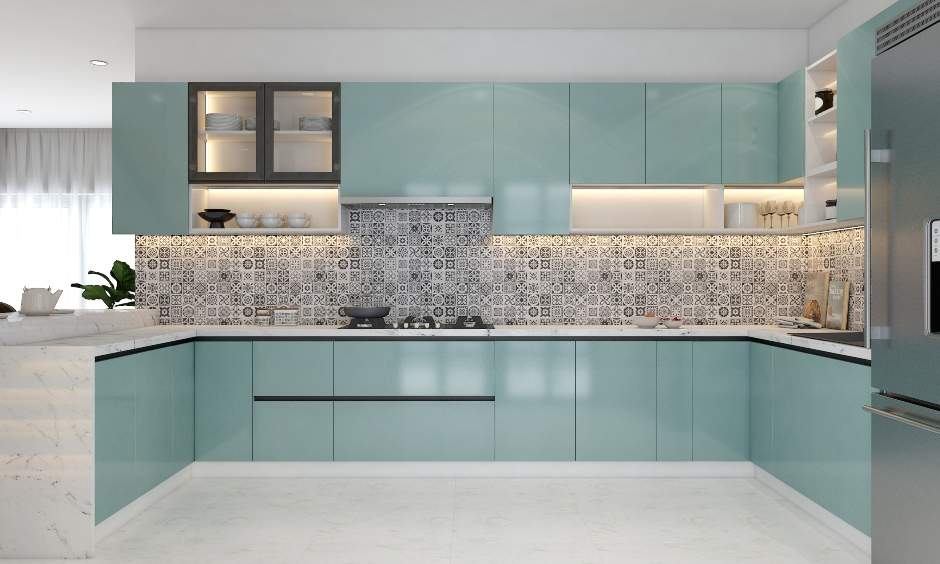 U-shaped kitchen with blue cabinets and a marble countertop