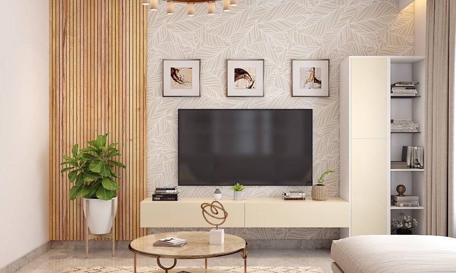 A tv unit design in the living room features a floating cabinet with handlesless drawers