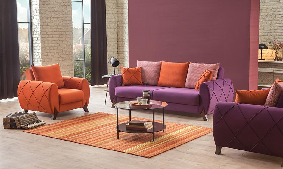 Warm rust and deep plum define a luxe drawing room interior colour with depth and sophistication.