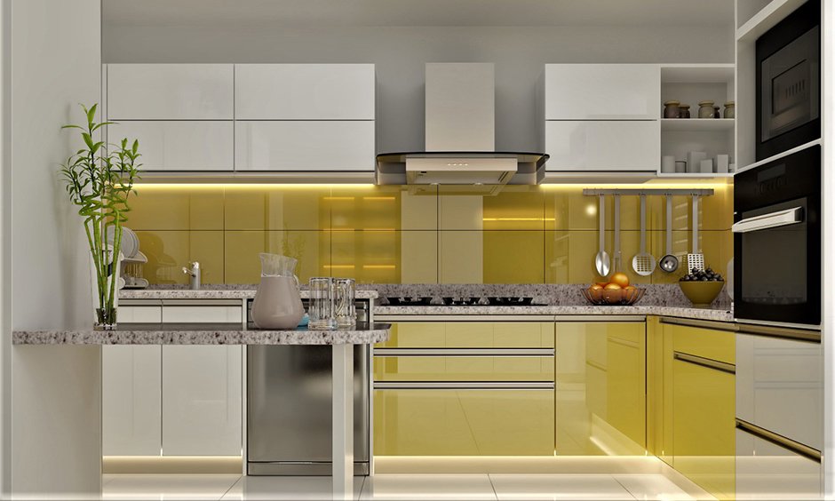 A stunning yellow lacquered glass modular kitchen